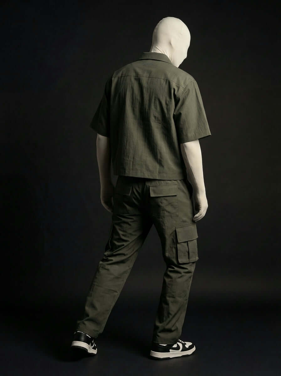 Model wearing Olive Utility Zip Co-ord set, featuring a short-sleeve top and cargo pants in olive green.