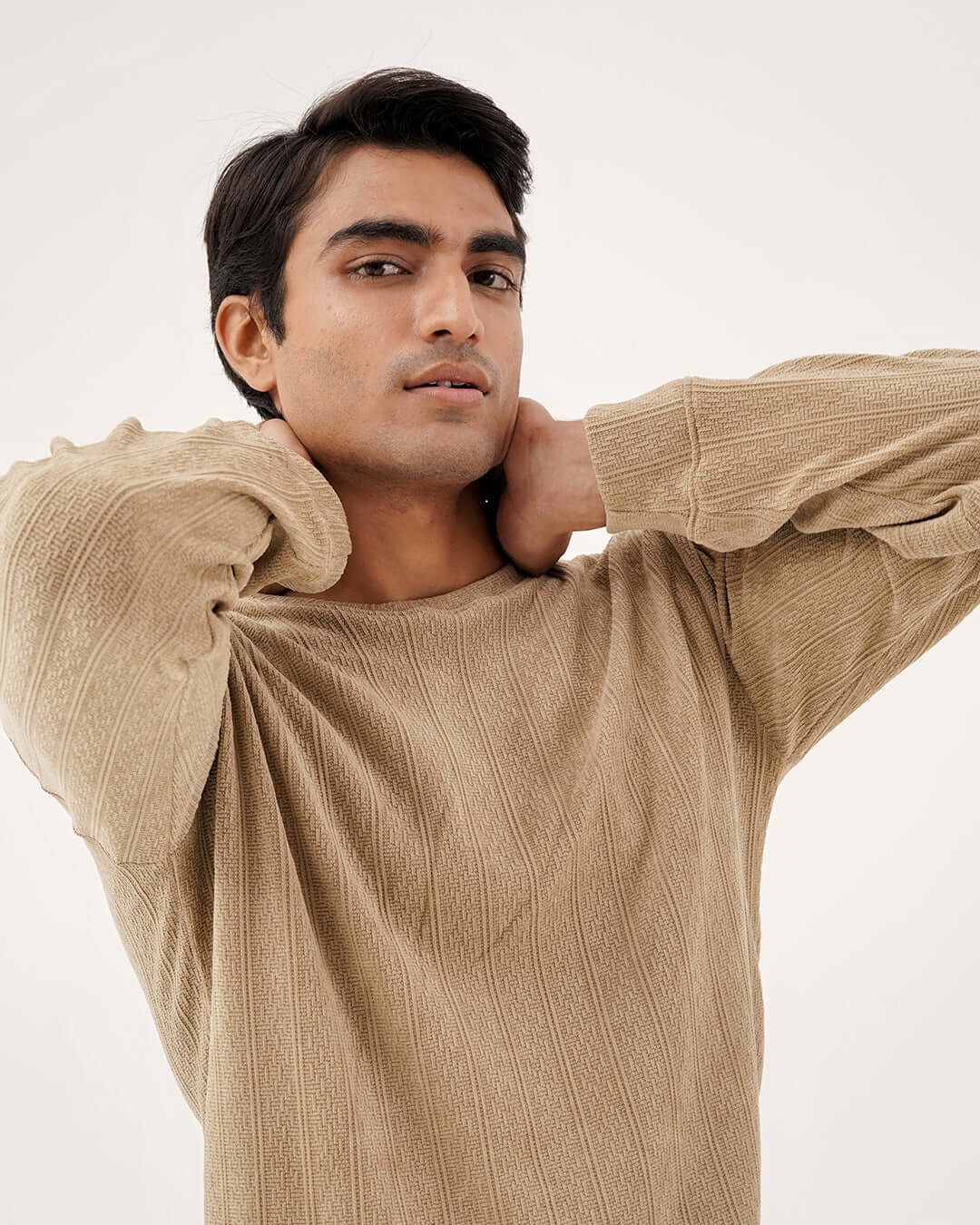 Daily Luxe Jacquard Sweatshirt – Desert Sand worn by a model, showcasing the rich texture and cozy design.