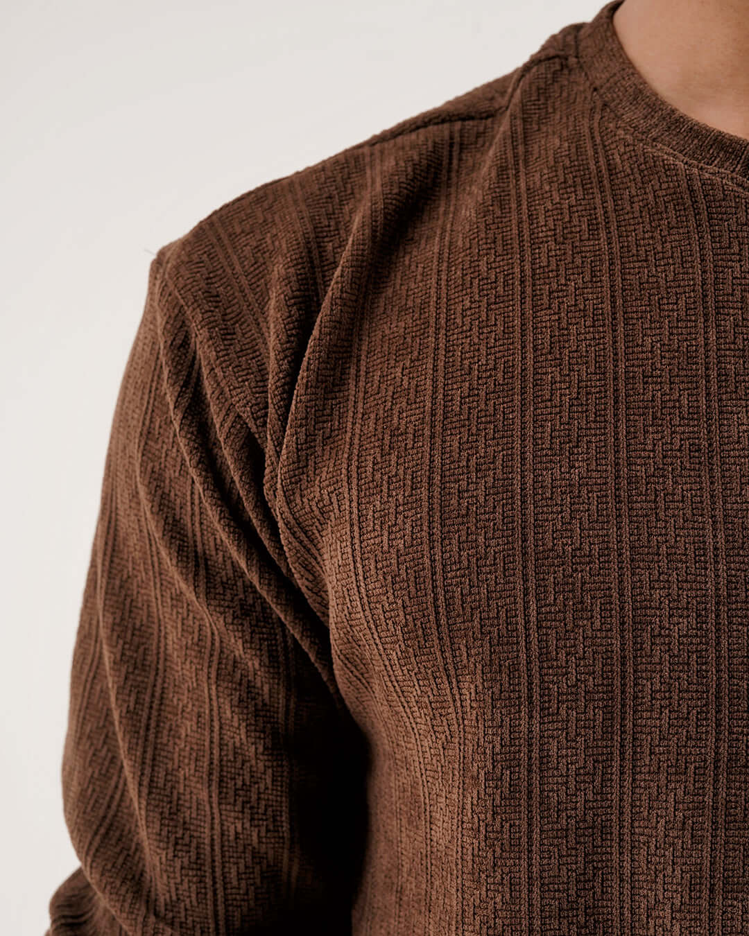Daily Luxe Jacquard Sweatshirt – Chestnut Brown close-up showing textured fabric in warm earthy tones.