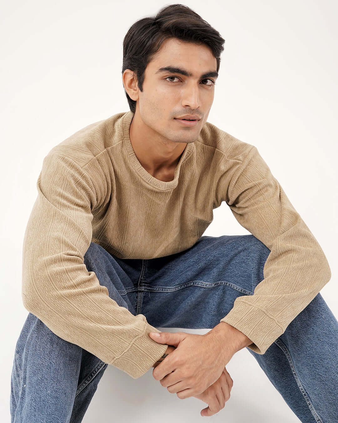 Daily Luxe Jacquard Sweatshirt – Desert Sand worn by a model, showcasing its cozy fabric and stylish design.