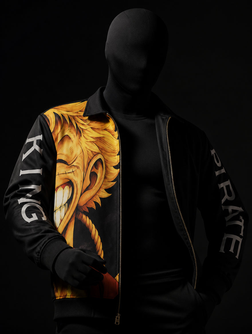 Close-up of black zip jacket on mannequin showing anime face print, KING and PIRATE sleeve lettering, gold zipper