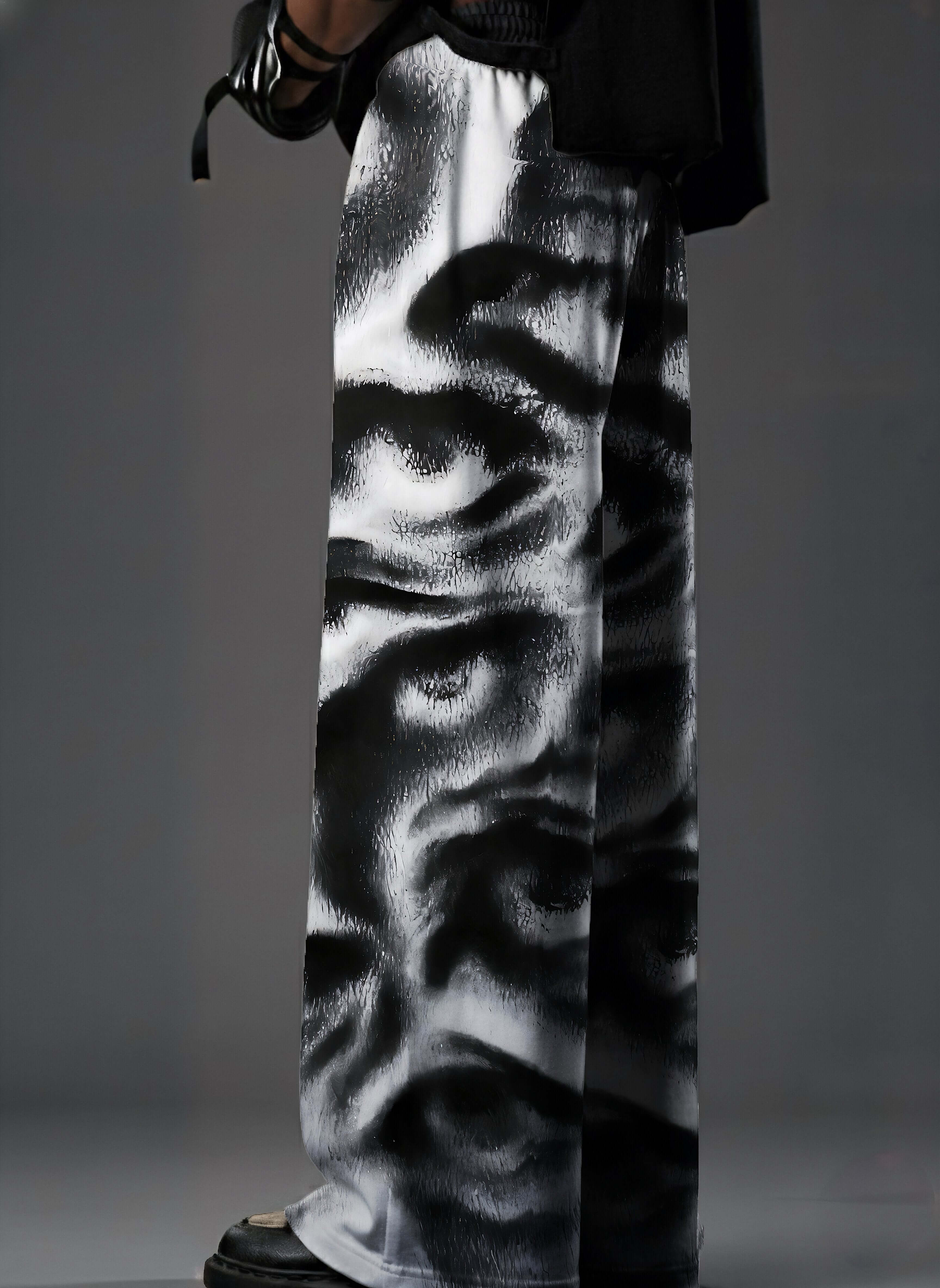 Noir Visage, Printed Baggy Pants, Black Baggy Pants, Monochrome Pants, Baggy Fit Pants, Streetwear Pants, Oversized Pants, Graphic Print Pants, Statement Pants, Urban Streetwear, Unisex Streetwear, Relaxed Fit Pants, Trendy Bottomwear, Contemporary Fashio
