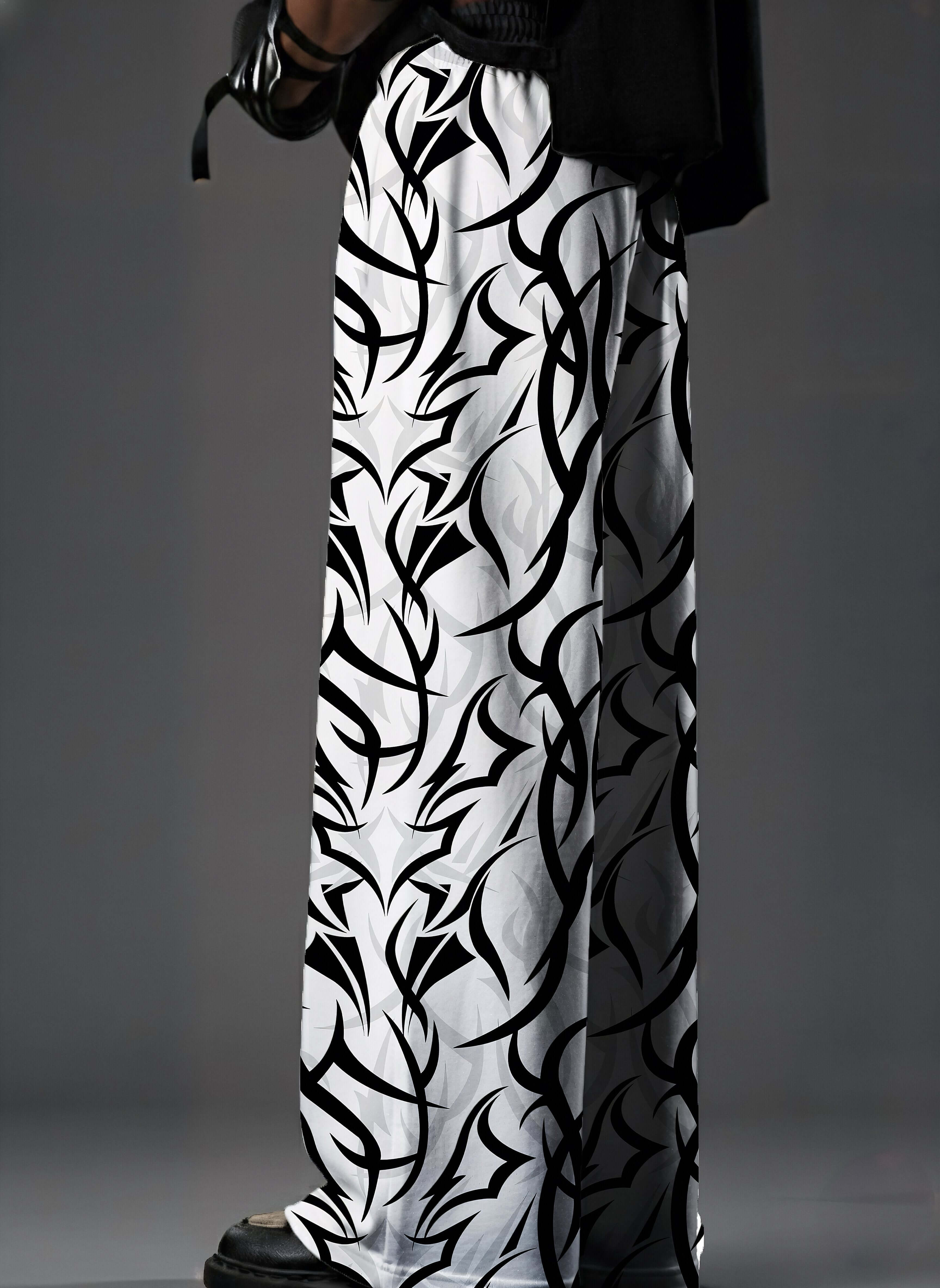 Tribal Edge, Printed Baggy Pants, Black and White Pants, Baggy Fit Pants, Streetwear Pants, Oversized Pants, Graphic Print Pants, Monochrome Pants, Statement Pants, Urban Streetwear, Gen Z Fashion, Unisex Streetwear, Relaxed Fit Pants, Trendy Bottomwear, 
