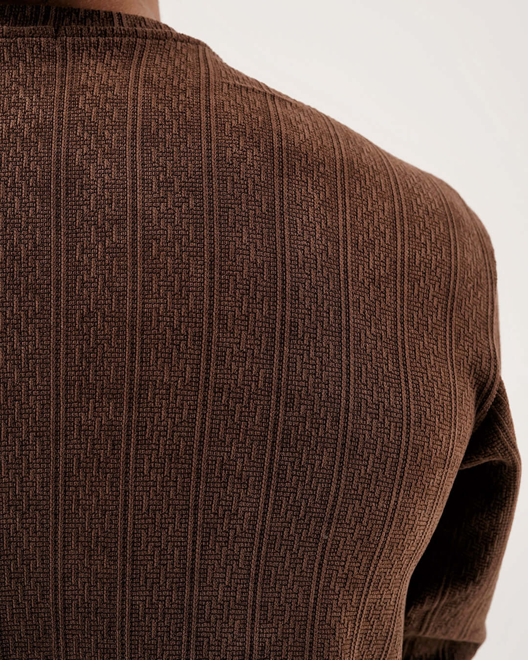 Close-up of the textured back of the Daily Luxe Jacquard Sweatshirt – Chestnut Brown in a rich brown hue.
