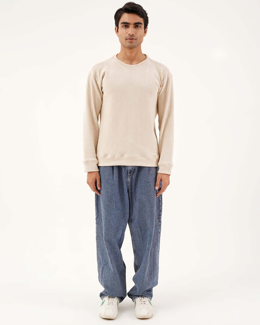 Daily Luxe Jacquard Sweatshirt – Ivory Cream worn with relaxed-fit denim pants.