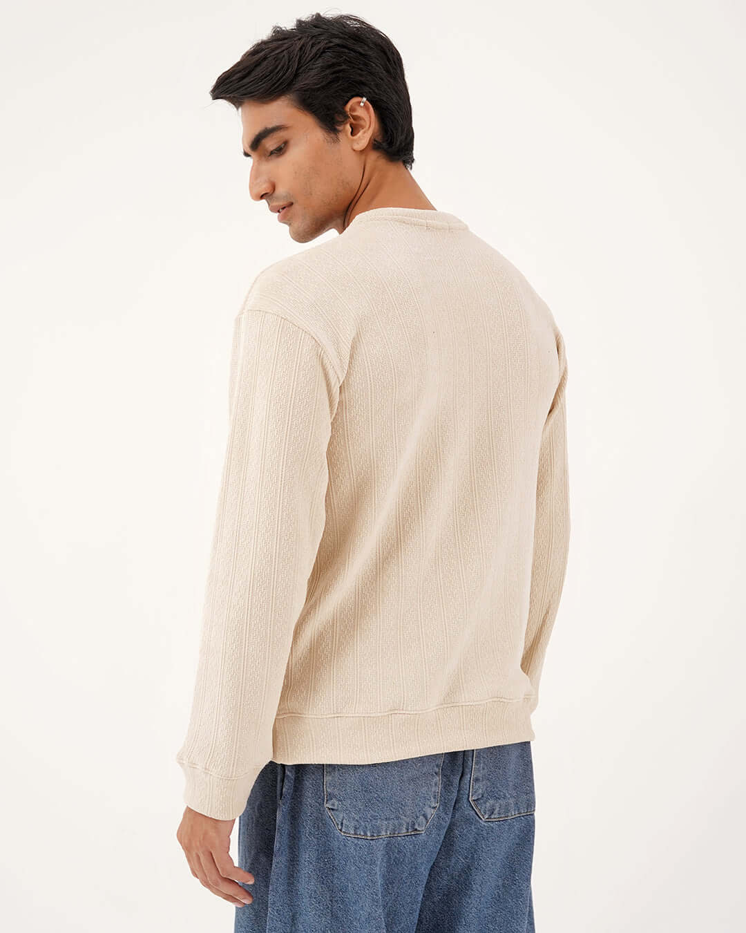 Model wearing the Daily Luxe Jacquard Sweatshirt – Ivory Cream from the back, showcasing its soft texture and fit.