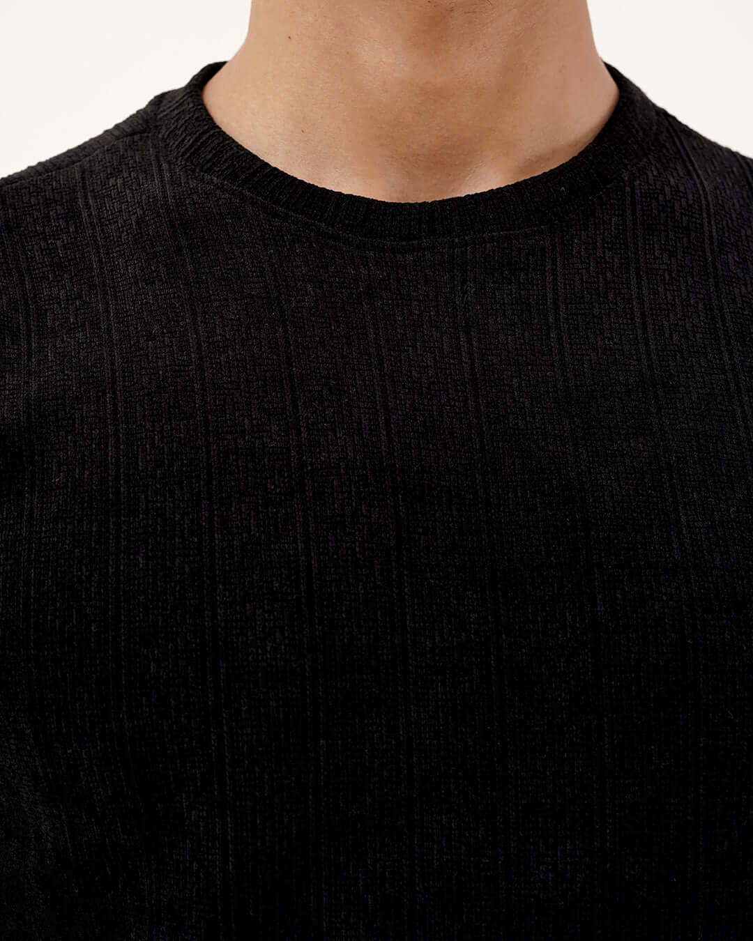 Close-up of the Daily Luxe Jacquard Sweatshirt in Midnight Black showcasing textured pattern and premium fabric.