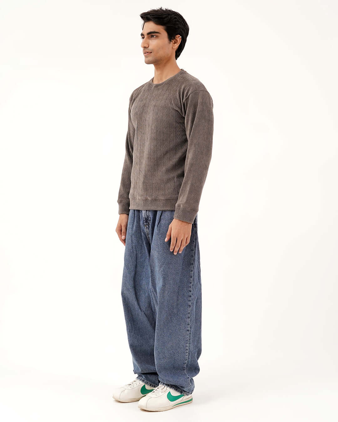 Daily Luxe Jacquard Sweatshirt worn by a model standing in casual attire, showcasing its stone grey color and relaxed fit.