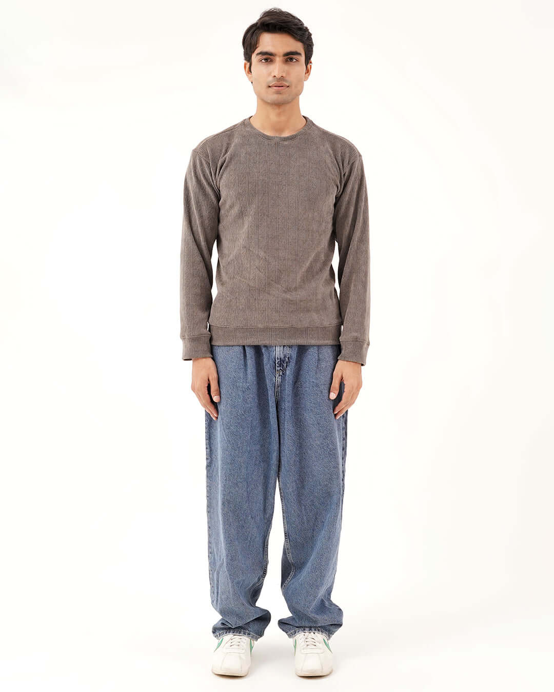 Daily Luxe Jacquard Sweatshirt worn by a model, showcasing a stylish stone grey design, paired with relaxed denim pants.