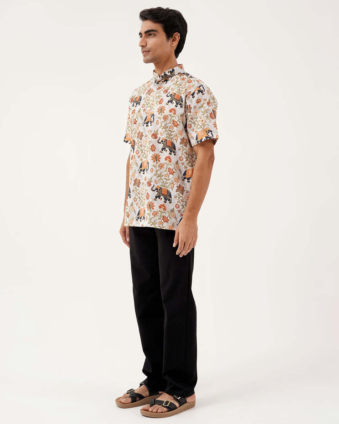 Model wearing Golden Dynasty Short Kurta featuring vibrant floral motifs and a stylish collar.