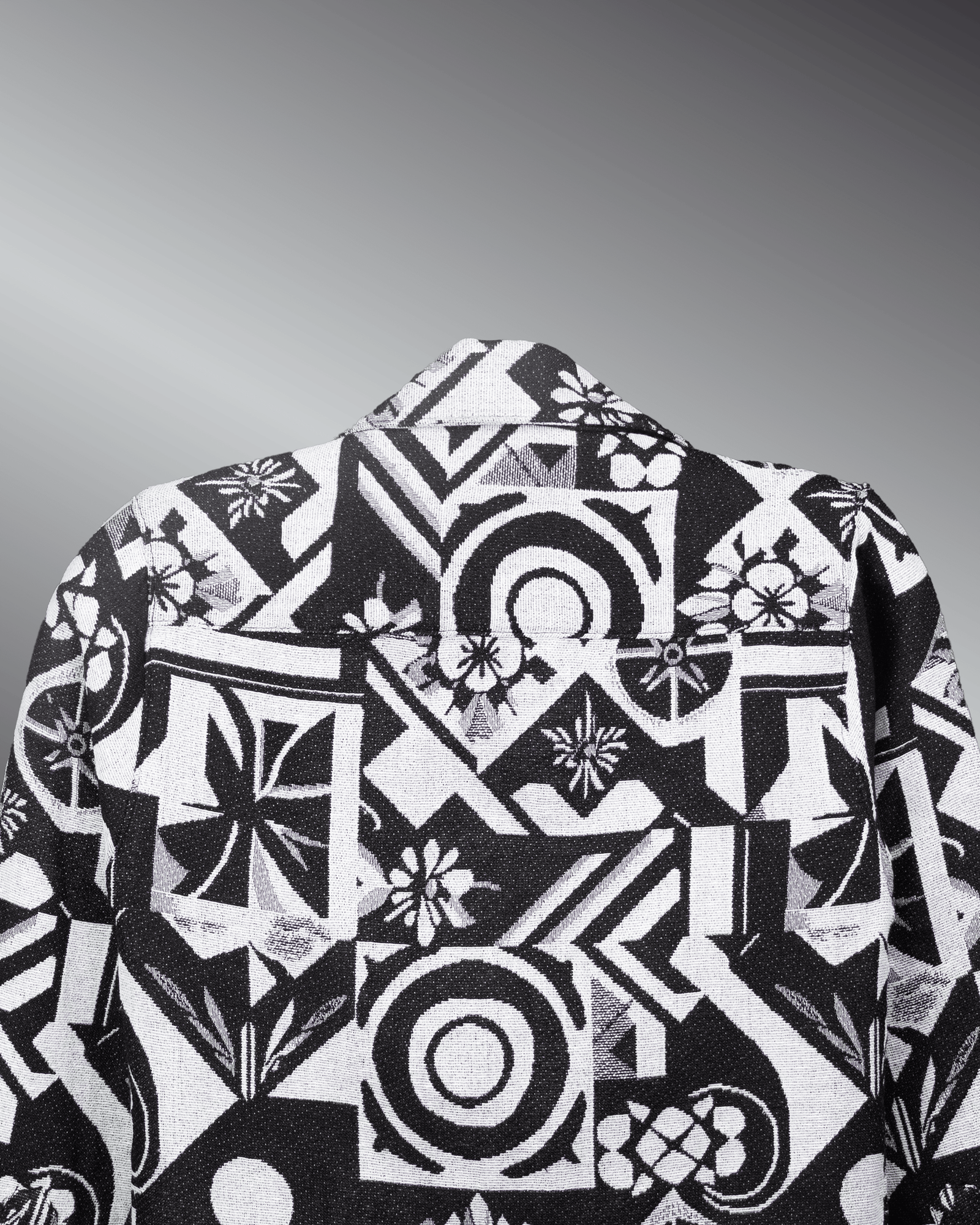 Graphic Illusion Shacket with black and white geometric pattern on a gray background, showcasing stylish design and texture.