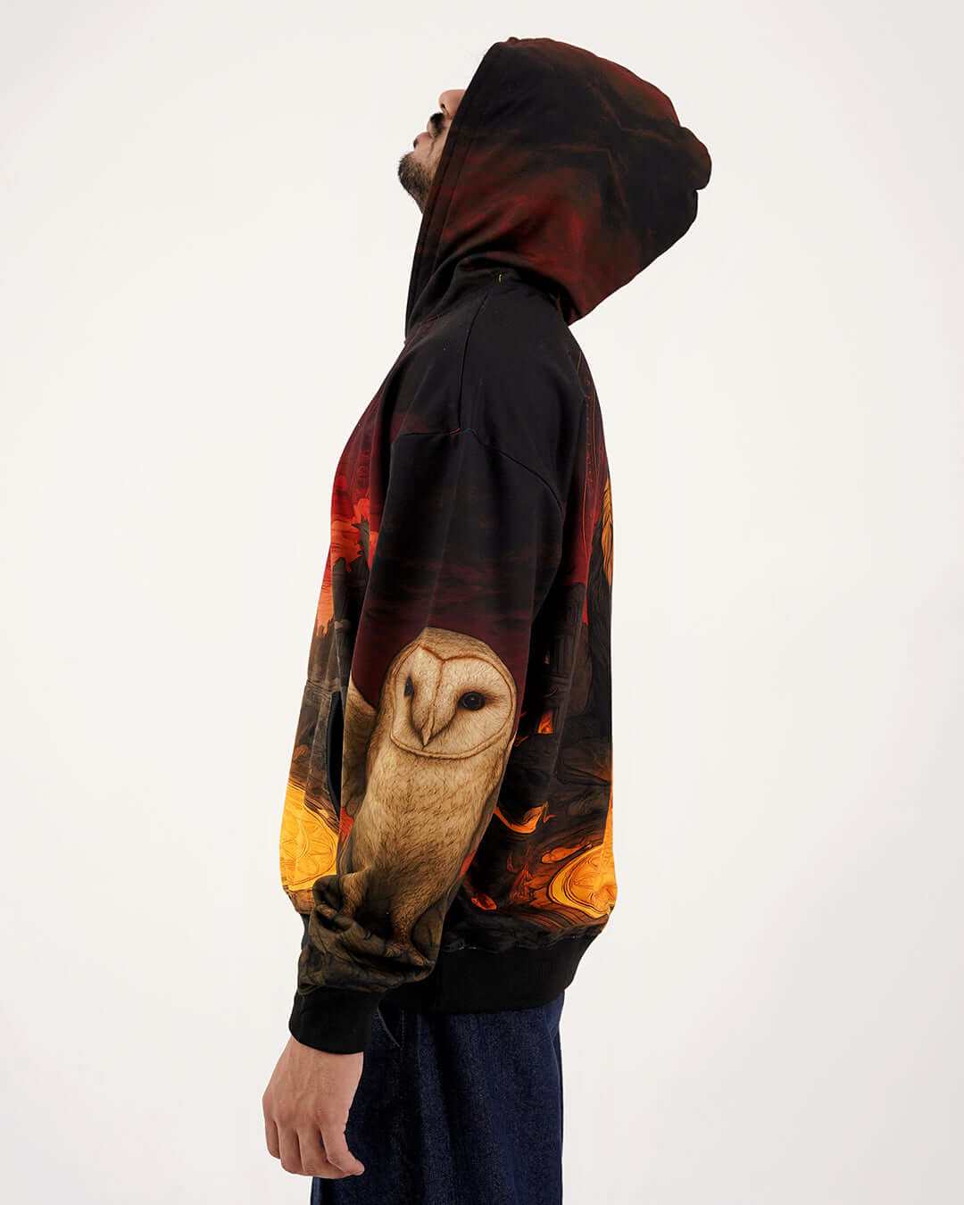 KAAL Dark Age Hoodie featuring a mythical owl design and a dramatic urban background, showcasing its unique streetwear aesthetic.