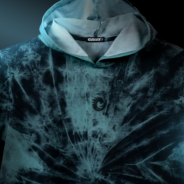 Stormcore Spiral oversized hoodie in dark tie-dye with hood and logo, showcasing urban streetwear style.