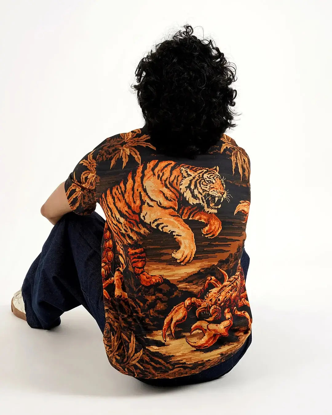 A person wearing the Predator’s Printed Tee featuring a tiger graphic design, showcasing bold streetwear style.